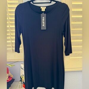 Brand new YELETE black dress 3/4 lgth. sleeve soft to skin high scoop pockets.